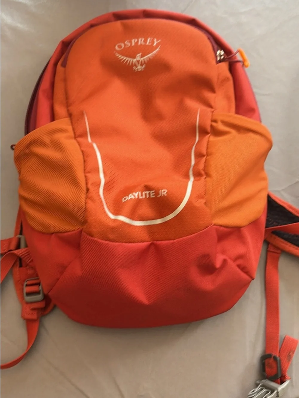 OSPREY Kids Daylite Jr Daypack in Bright Orange with Blue Hydration Reservoir